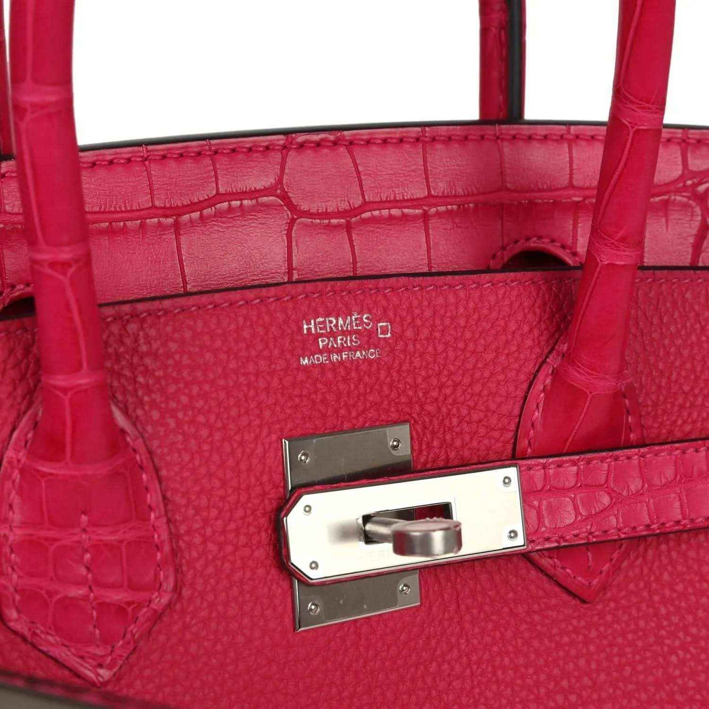 Elegant red leather handbag with crocodile texture and silver hardware, timeless and sophisticated
