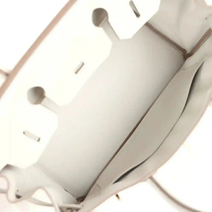 Elegant beige leather tote bag interior with refined, sophisticated detailing.