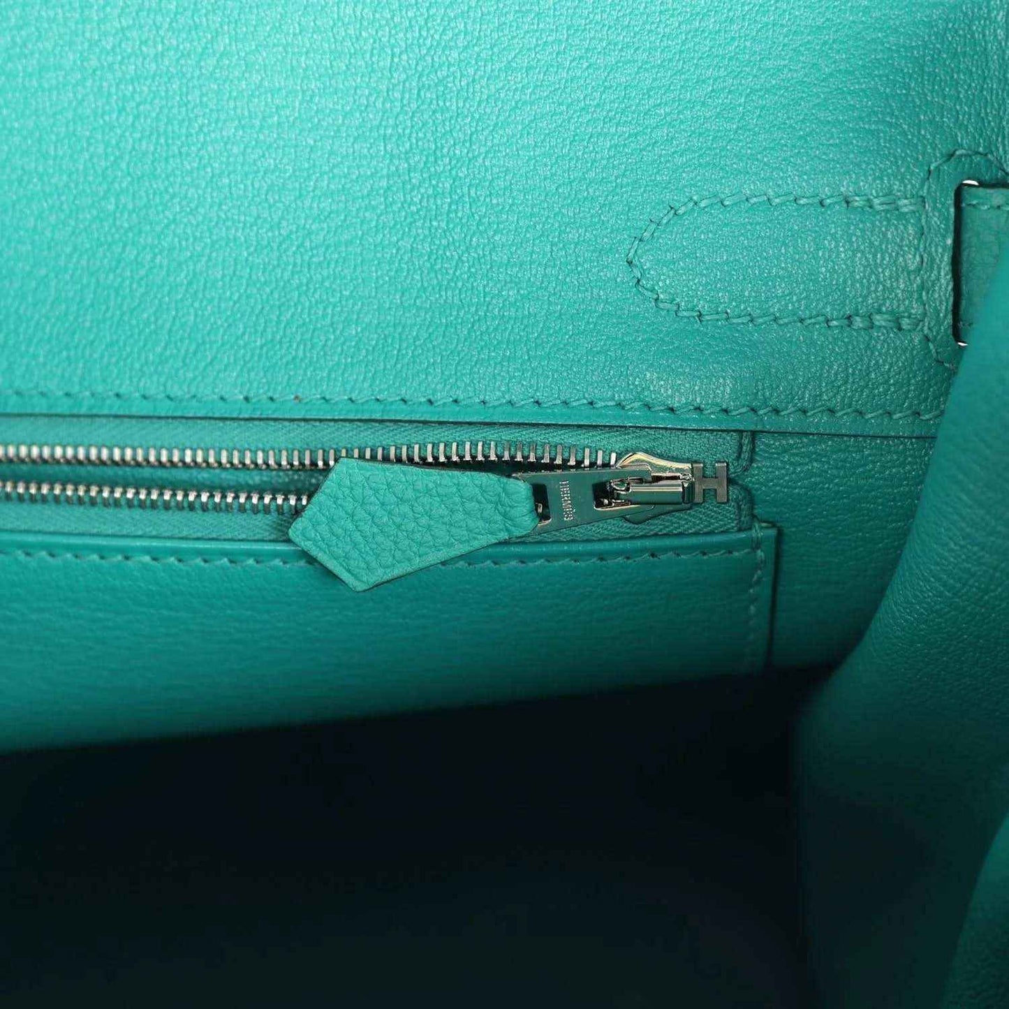 Green Togo leather Birkin close-up of zipper pull and stitching