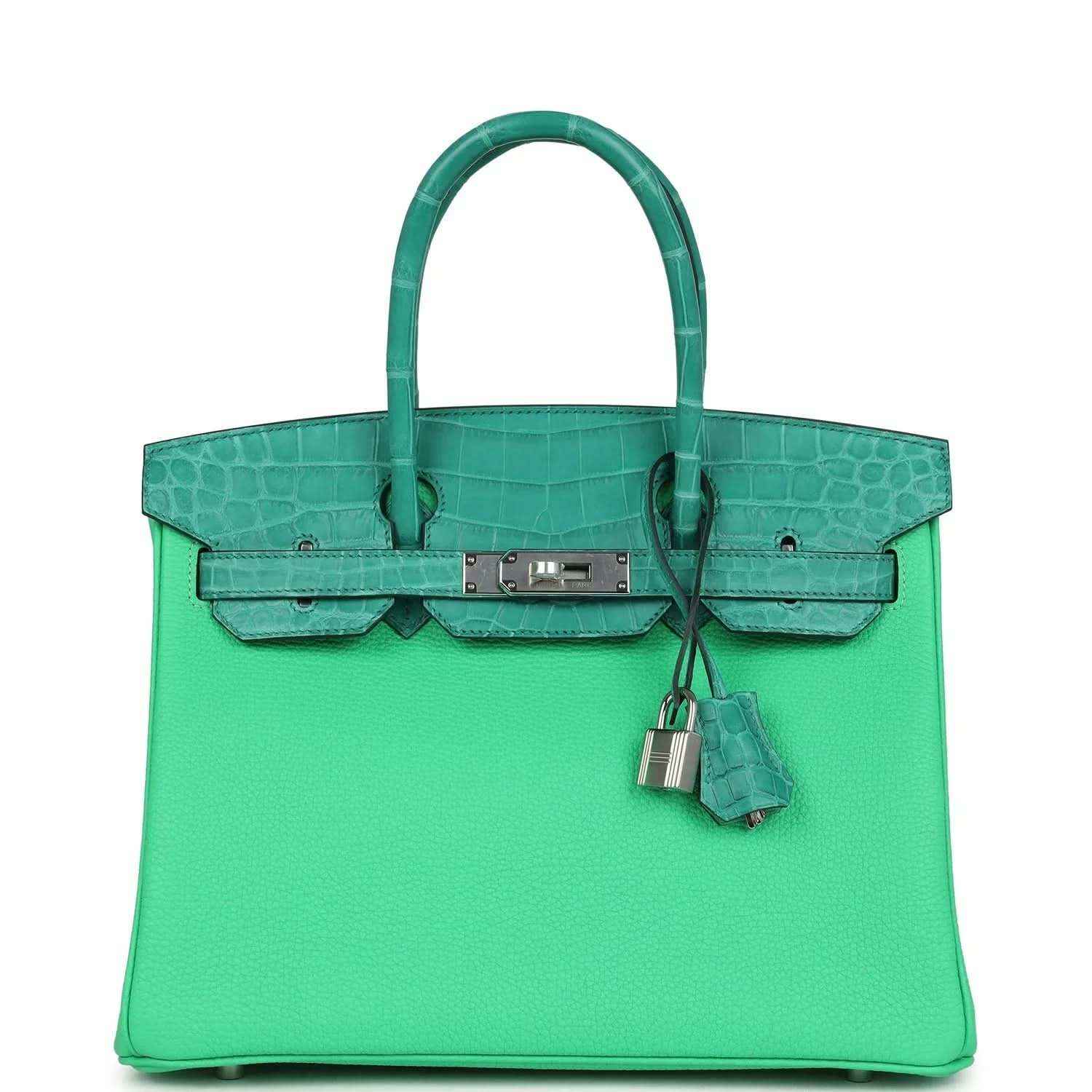 Elegant green leather handbag with crocodile trim and silver hardware, timeless and sophisticated.