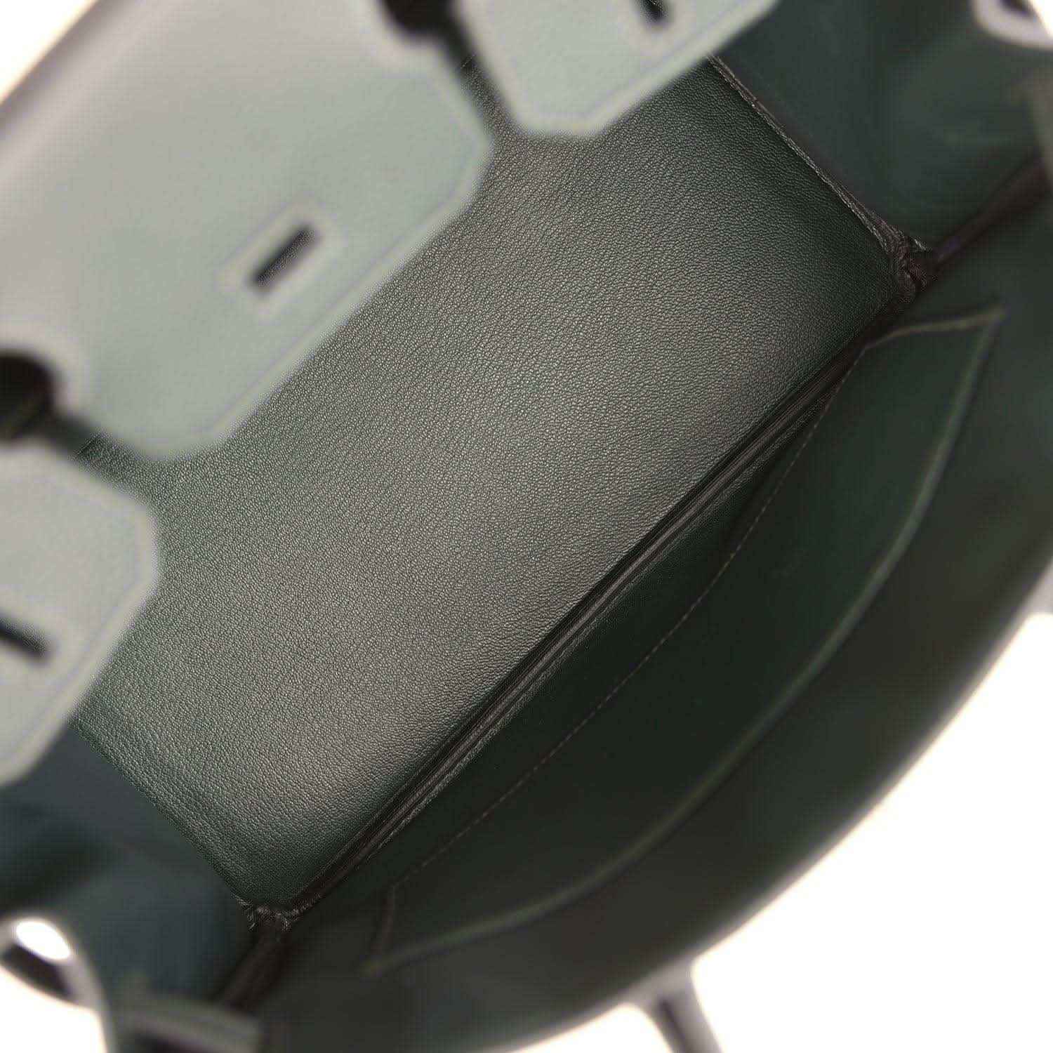 Interior view of a timeless, elegant dark green leather women's handbag with refined finish