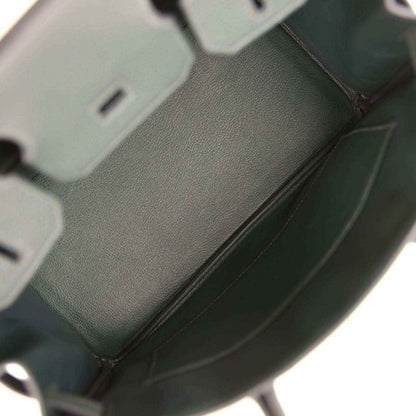 Interior view of a timeless, elegant dark green leather women's handbag with refined finish