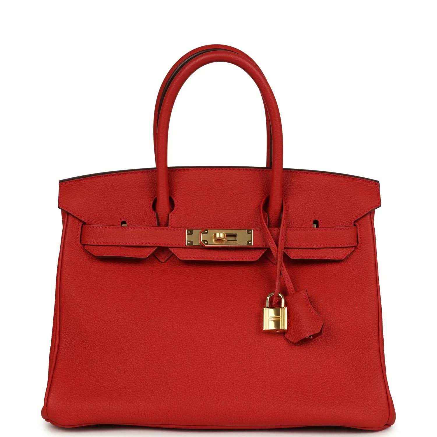 Timeless, elegant red leather handbag with gold hardware and sophisticated detailing.