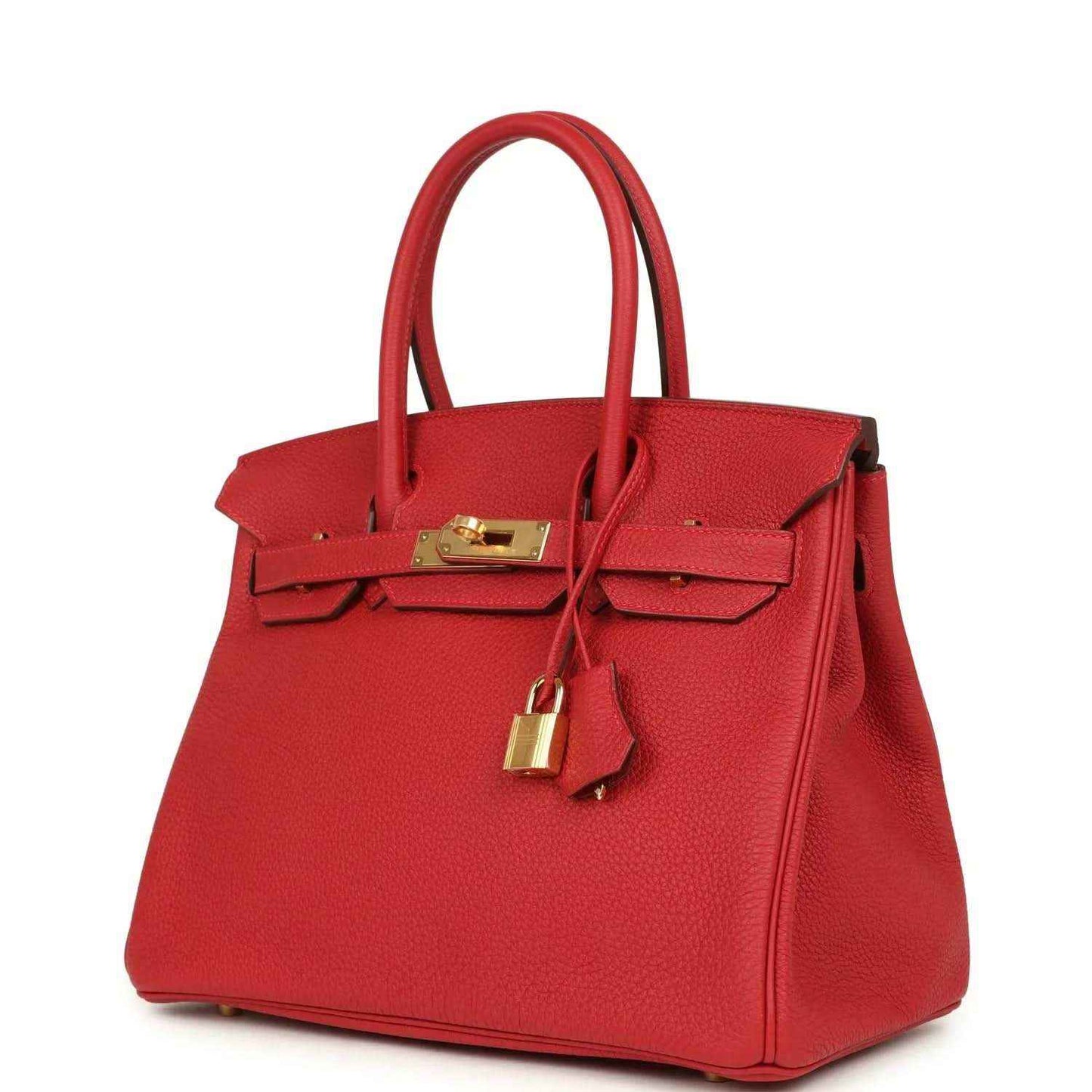 Elegant red leather handbag with gold hardware, showcasing timeless and sophisticated style