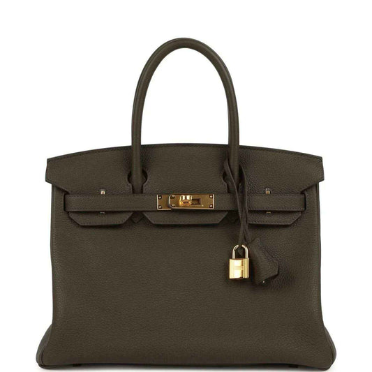 Timeless dark brown leather handbag with gold hardware, elegant and sophisticated style.