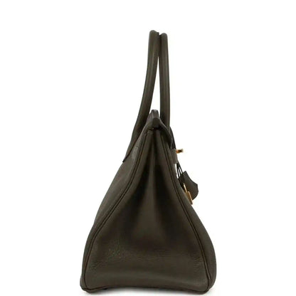 Timeless dark olive leather handbag with elegant structured silhouette and refined details