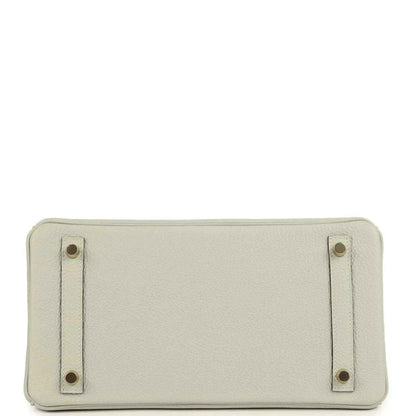 Timeless ivory leather handbag base with elegant gold-tone stud accents, sophisticated finish.