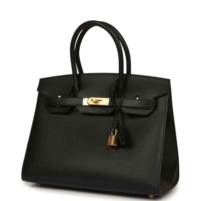 Birkin handbag front view in black leather with gold bar lock and hanging key lock