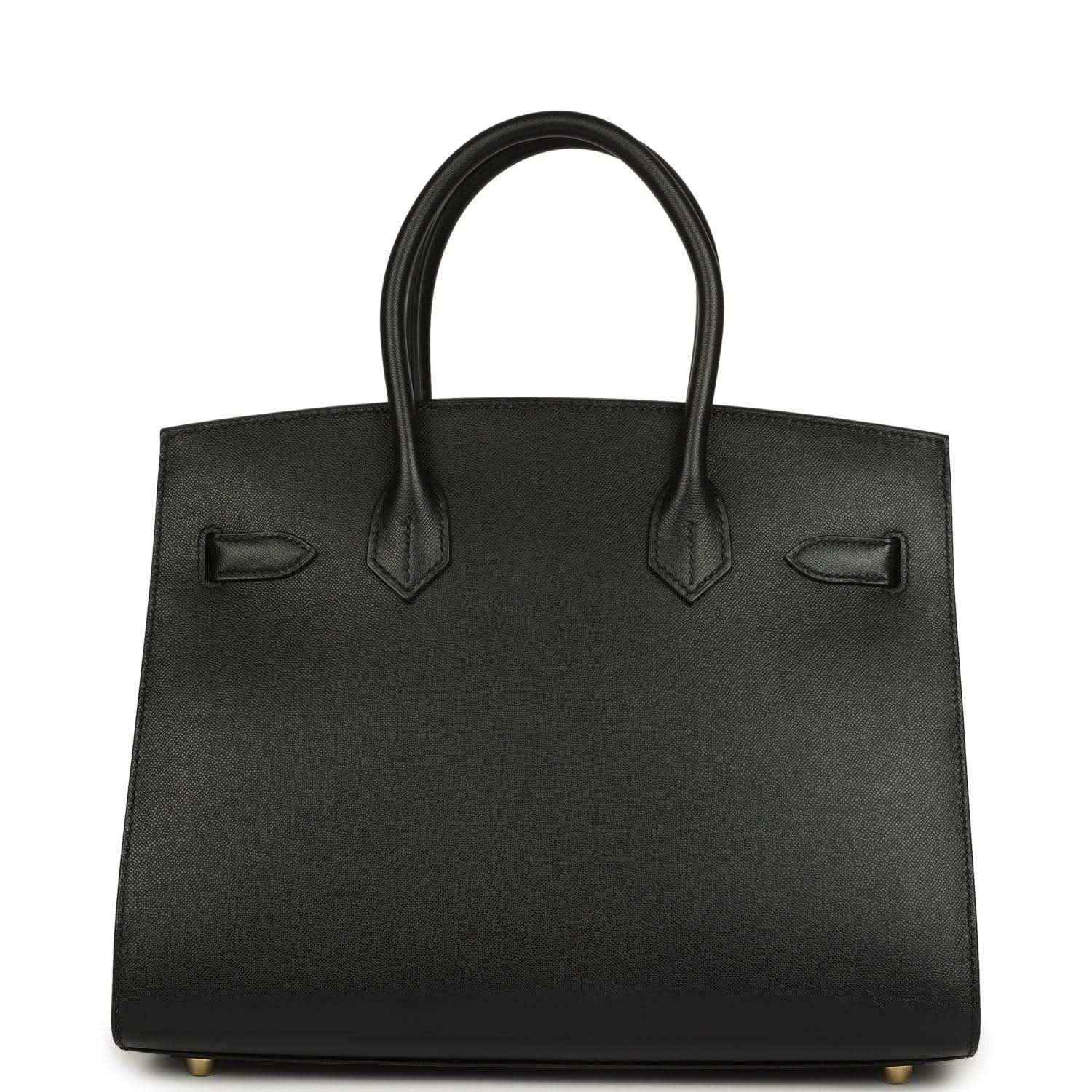 Birkin handbag front panel in black leather with strap details and gold-tone feet
