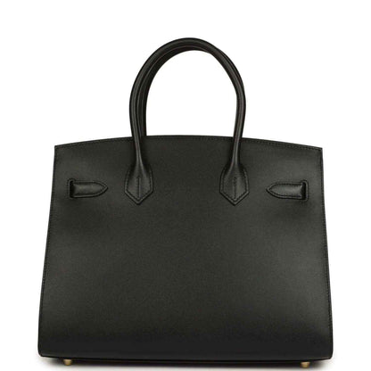 Birkin handbag front panel in black leather with strap details and gold-tone feet