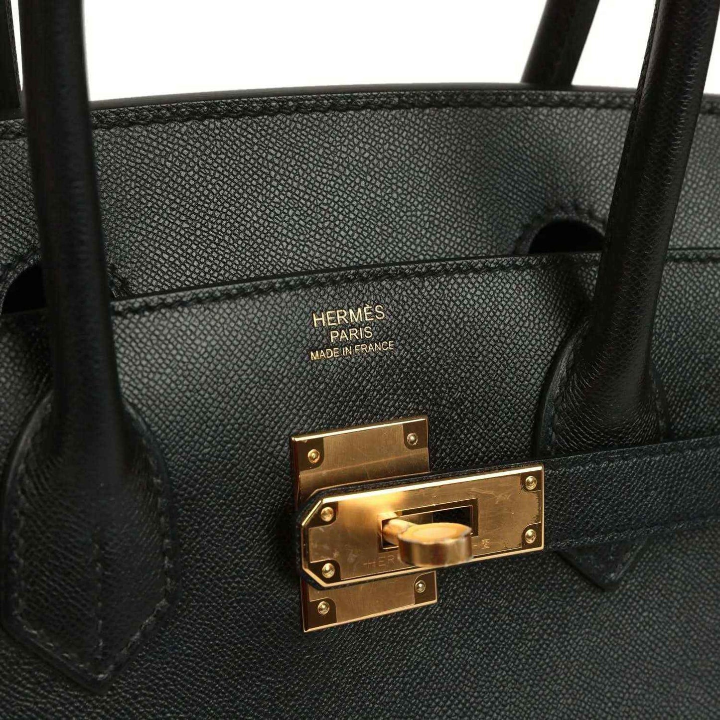 Birkin handbag interior with Hermes Paris stamp and gold-tone clasp hardware