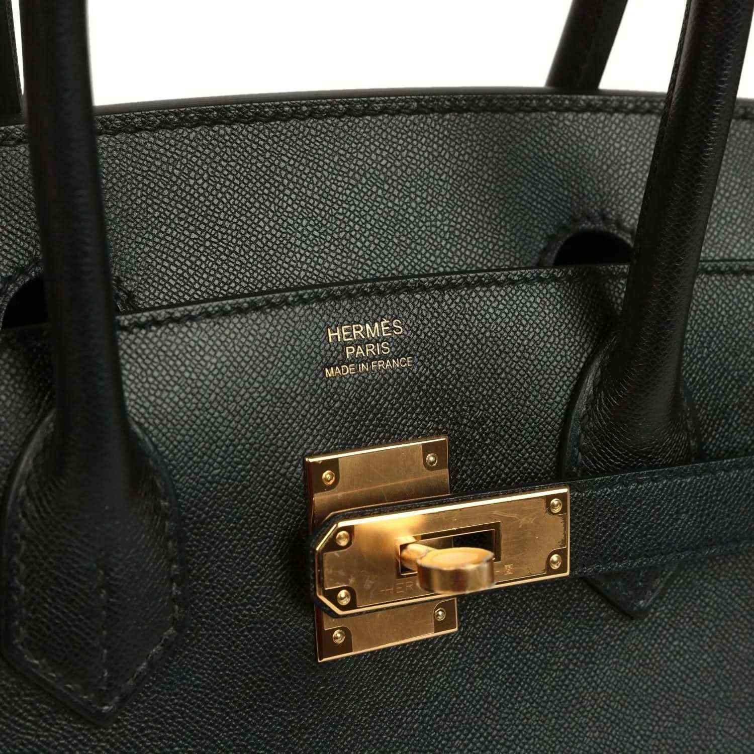 Birkin handbag interior with Hermes Paris stamp and gold-tone clasp hardware