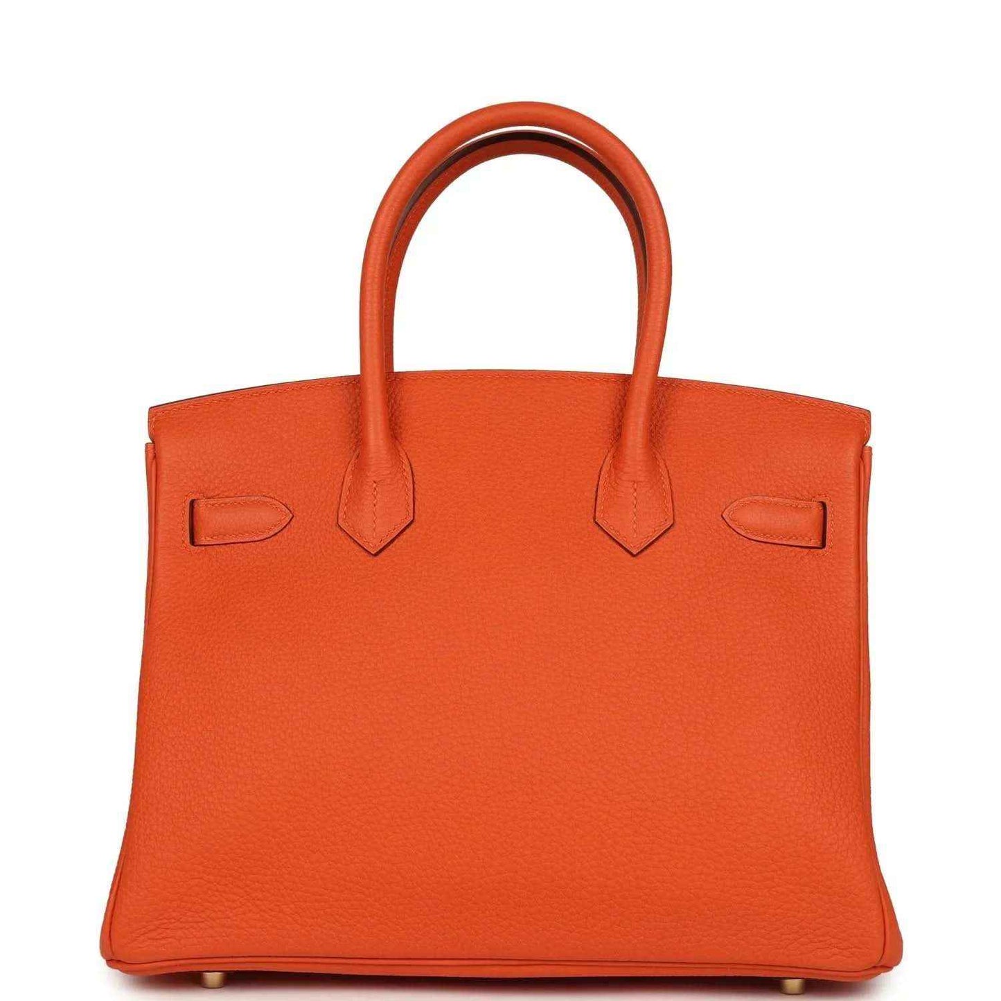 Timeless orange leather handbag with elegant top handles and sophisticated structure.