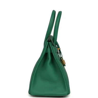 Green leather handbag with single top handle and gold-tone lock detail