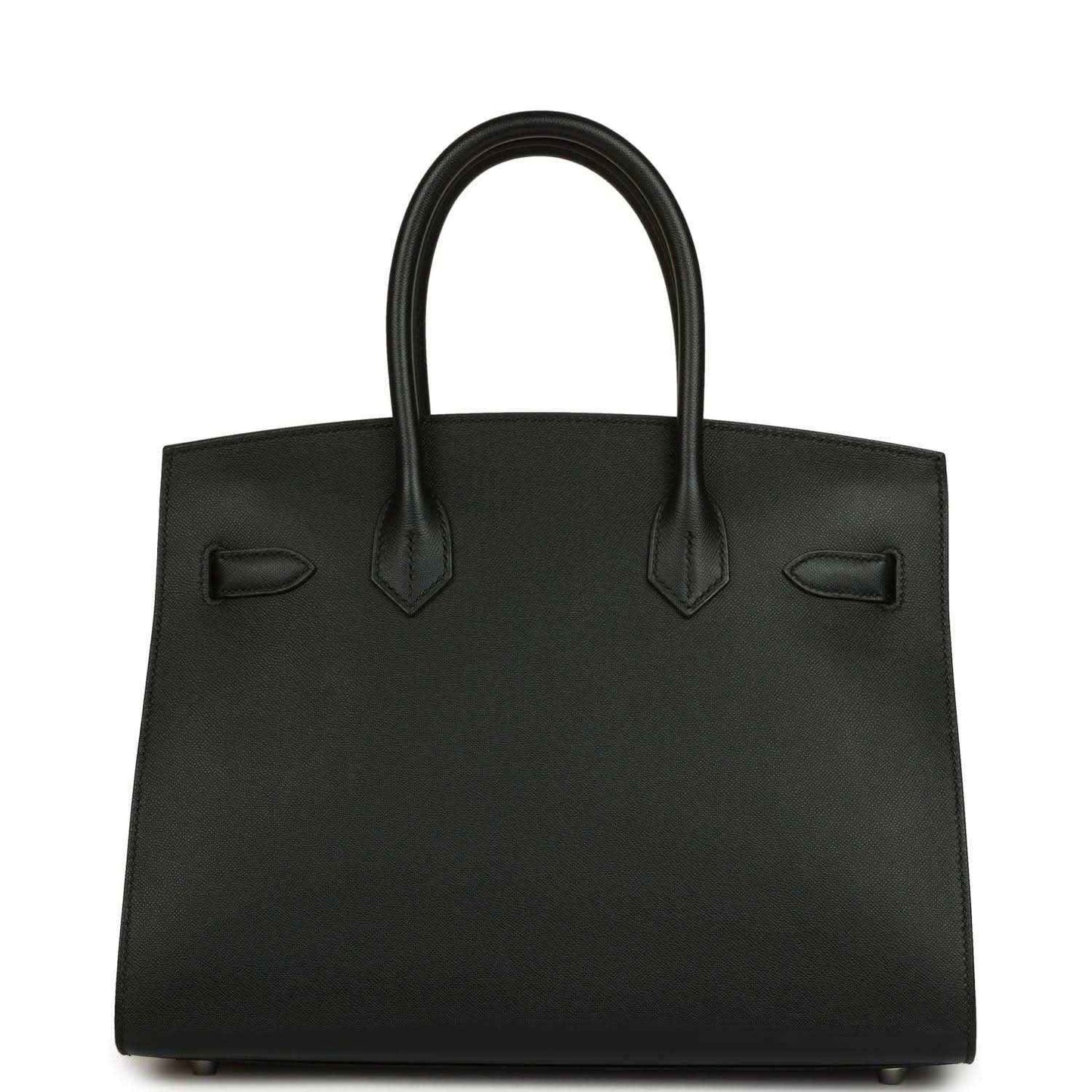 Black leather handbag with structured body, top handles, and front patch details