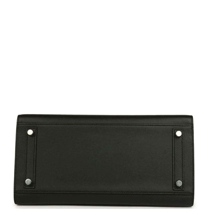 Black leather handbag bottom panel with metal corner tabs and stitching