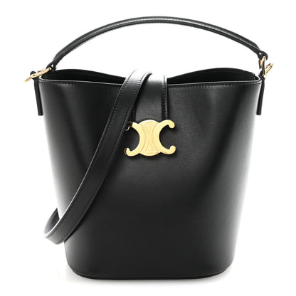 Small black Celine bucket bag with smooth finish, gold Triomphe logo, top handles