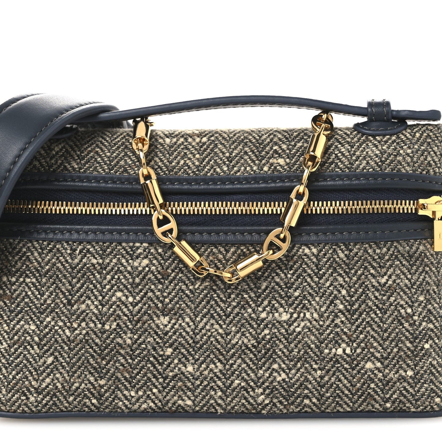 Mini pouch front view with herringbone fabric, navy strap, and gold chain centerpiece