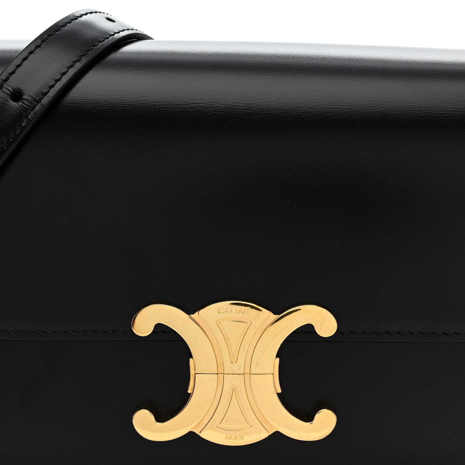 Black shiny leather flap bag with gold C logo medallion on front.