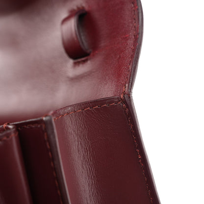 Celine burgundy leather flap area with stitched edge and boxy structure close-up