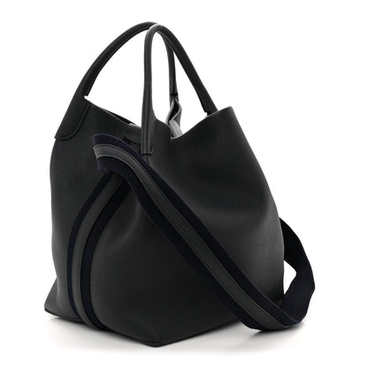 Large hobo-style dark navy tote bag with crossbody strap and curved silhouette