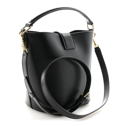 Small black Celine bucket bag with structured top, gold hardware, crossbody strap