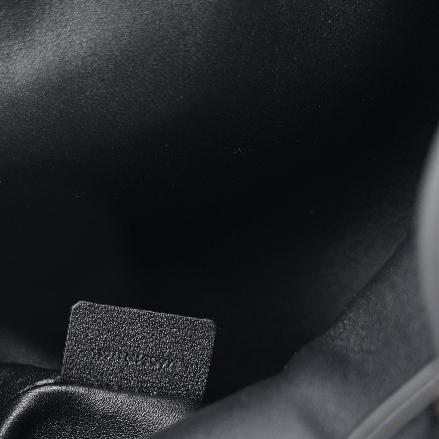 Celine calfskin Bonnie backpack close-up of stitched interior label.