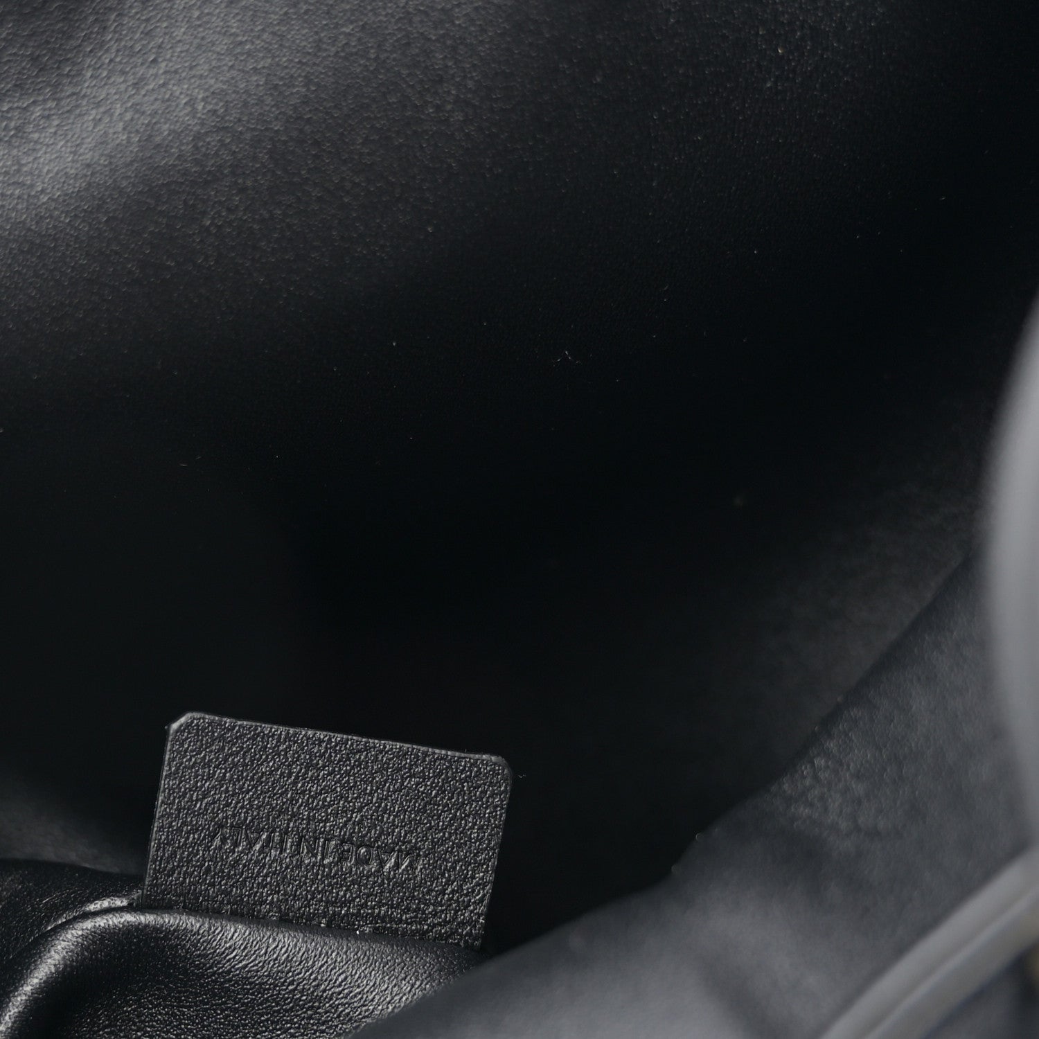 Celine calfskin Bonnie backpack close-up of stitched interior label.