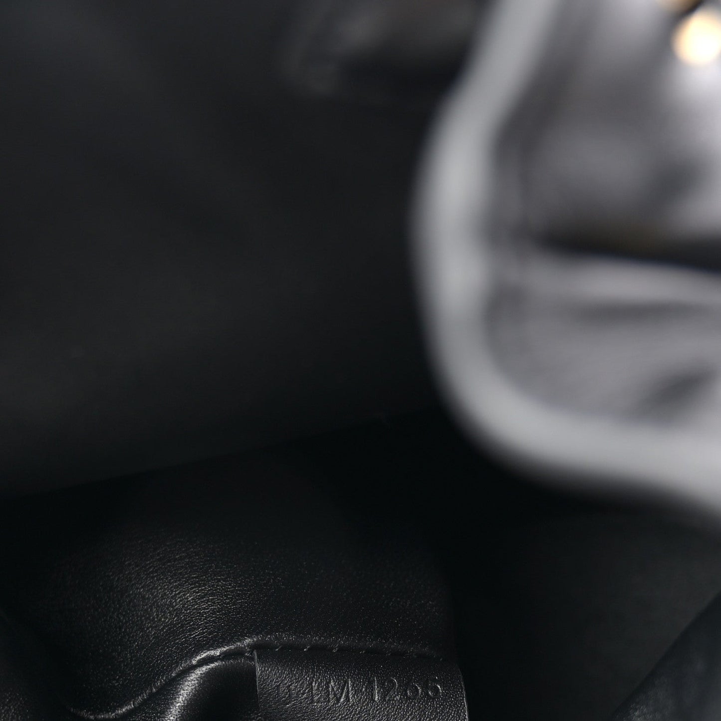 Celine calfskin Bonnie backpack close-up of embossed serial number.