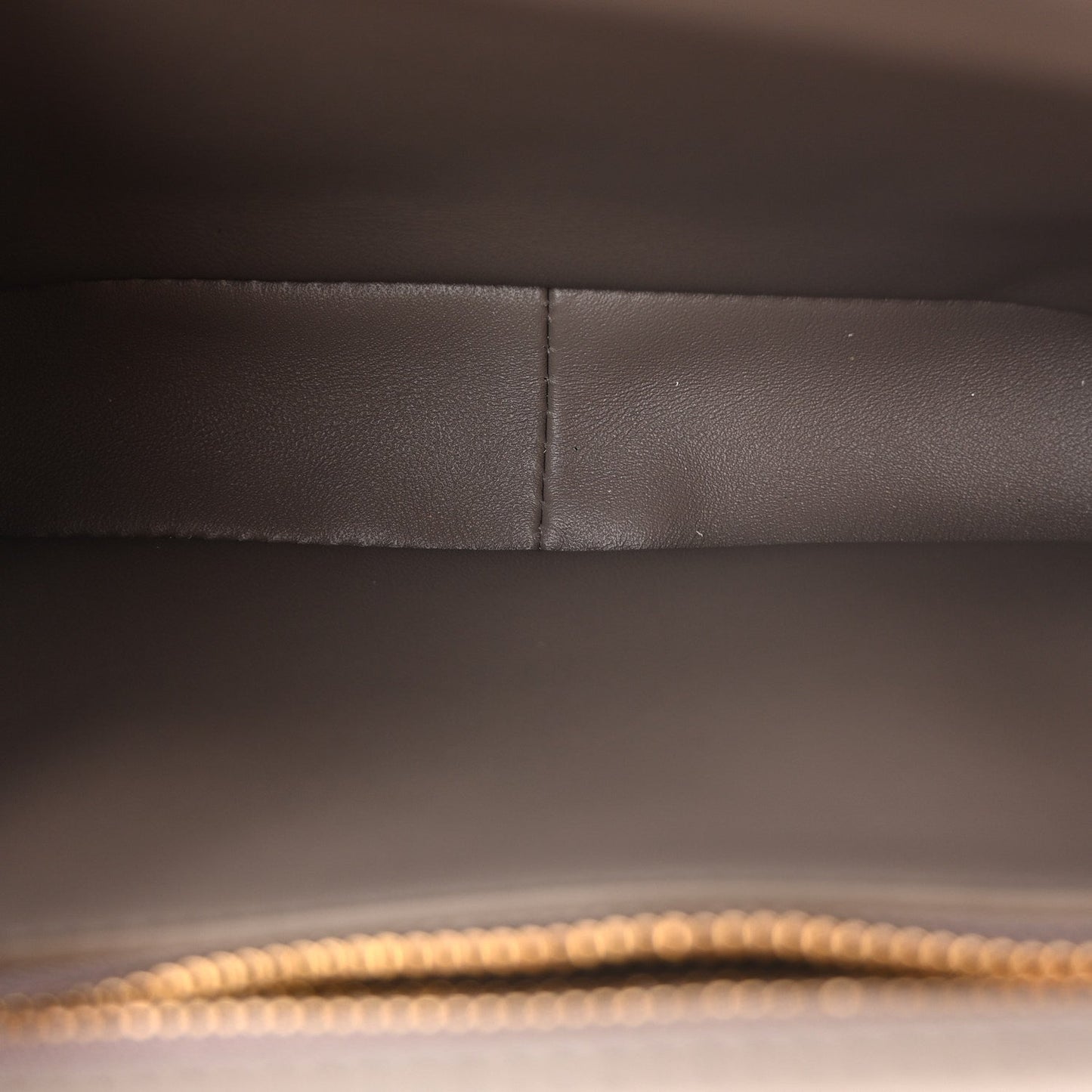Interior panel detail of Celine shiny calfskin shoulder bag in dark taupe tone