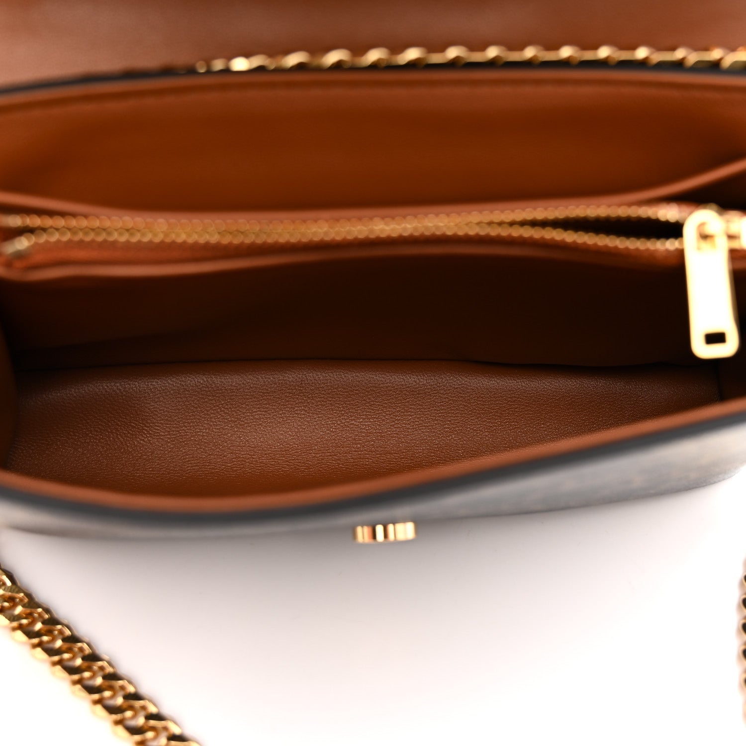 Celine Triomphe shoulder bag interior view with tan lining and gold zipper pull