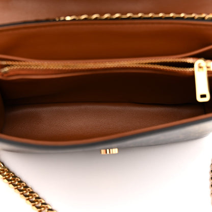 Celine Triomphe shoulder bag interior view with tan lining and gold zipper pull