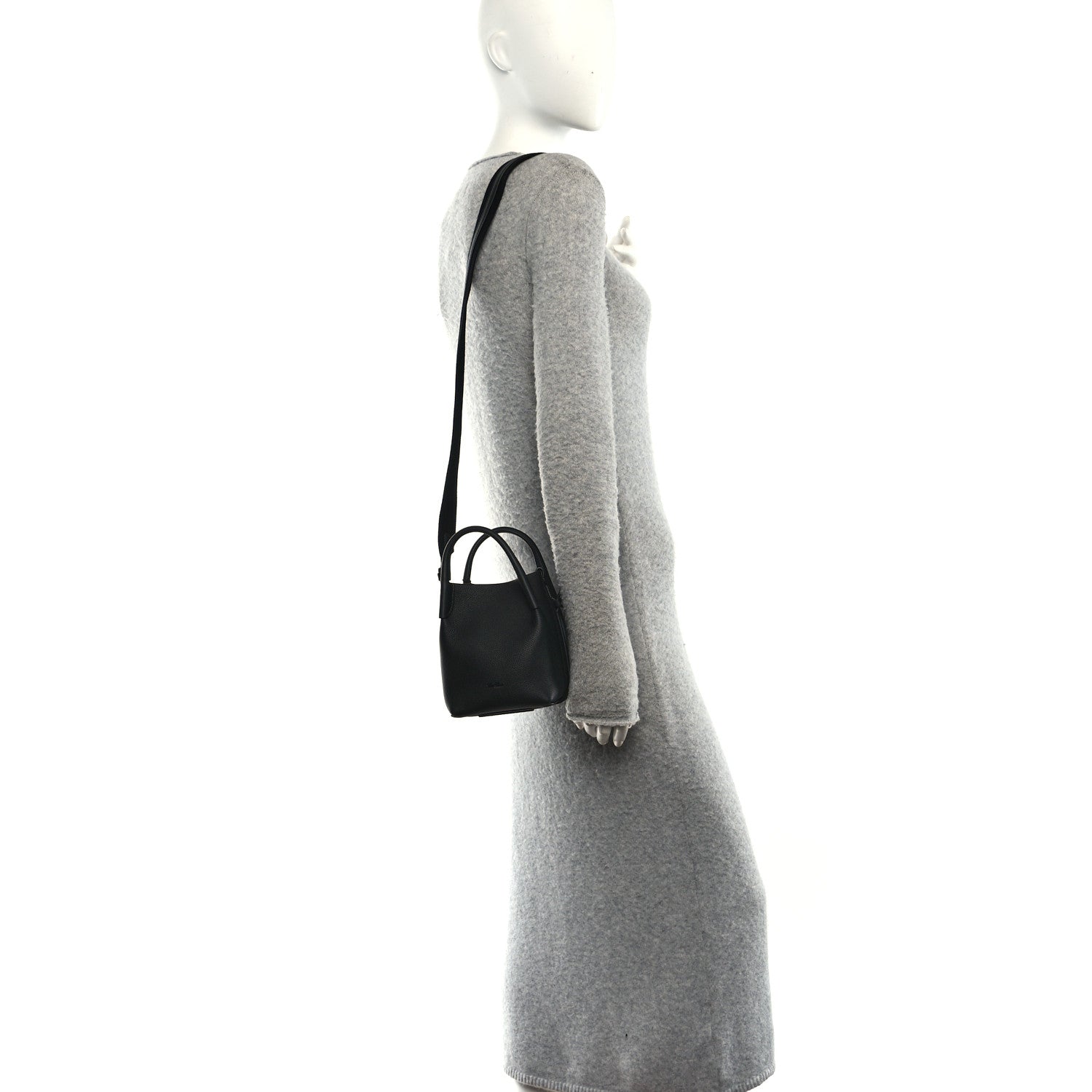 Black micro bale bag on shoulder strap, small grained leather silhouette