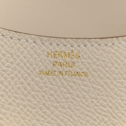 Hermès PARIS MADE IN FRANCE embossed on light cream textured leather
