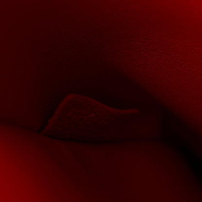 Red leather bag interior close-up, dark interior lining