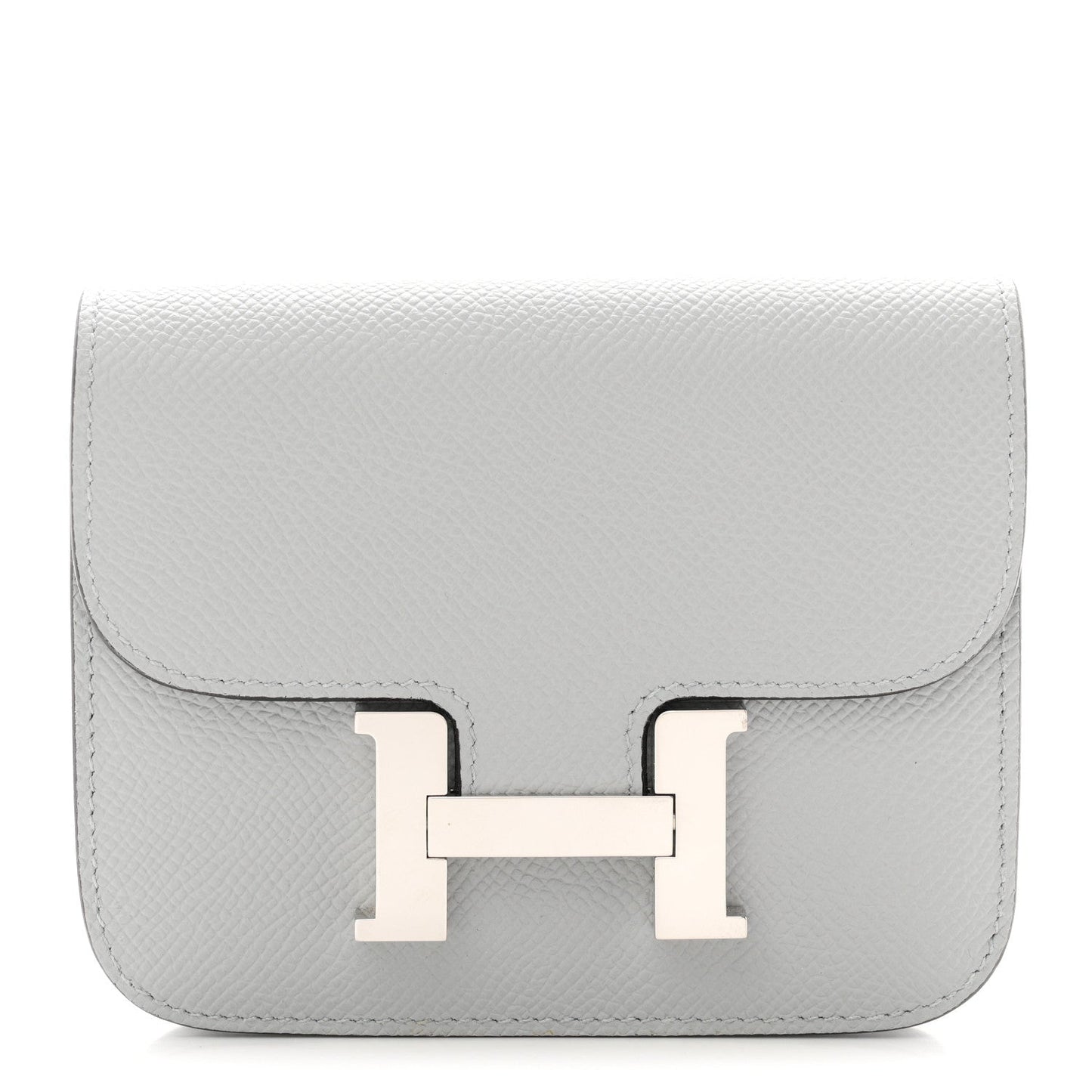 Hermes Constance slim wallet in light blue textured leather with front H clasp.