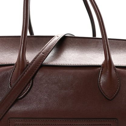 Leather handbag top handle bases with structured opening and stitched leather trim