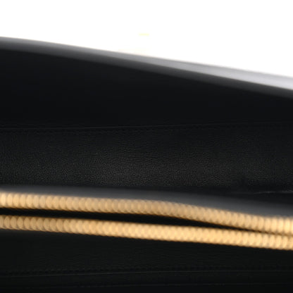 Black leather base with fine grain texture and gold trim edge