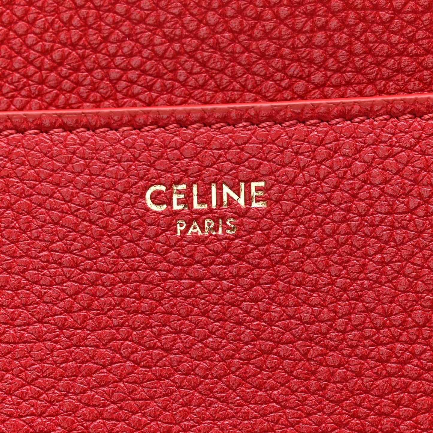 Red grained leather panel with CELINE PARIS logo embossing