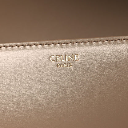 Celine Paris embossed on beige leather with visible edge stitching
