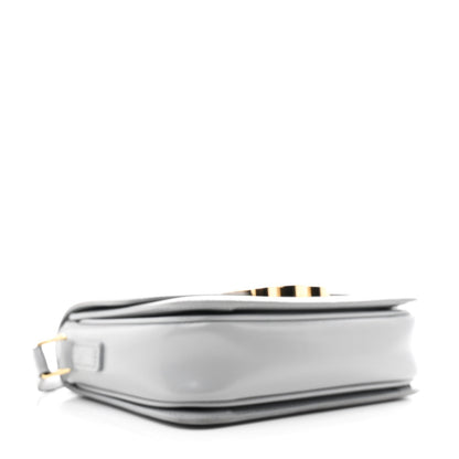 Shiny calfskin bag base detail with layered edge and gold-tone hardware