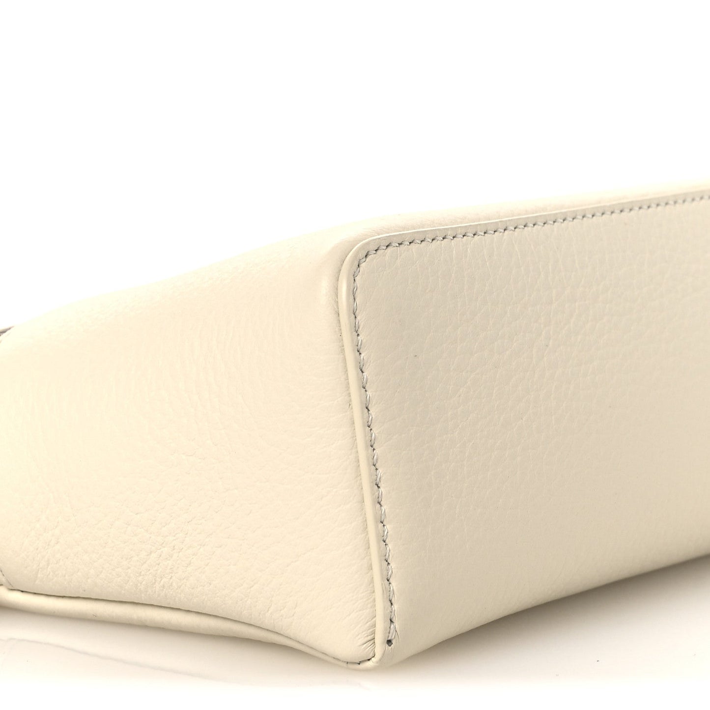 White grained calfskin pouch with stitched corner and rounded bottom edge