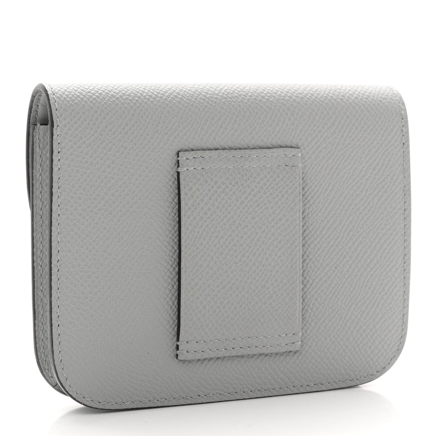 Hermes Constance slim wallet back, light blue textured leather with centered patch.