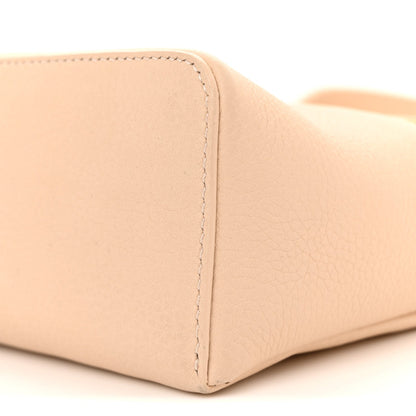 Cream leather pouch base corner with seam and textured grain
