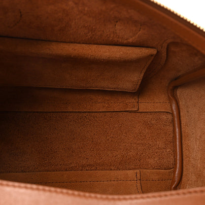 Tan leather tote interior with suede-like lining and stitched edge seams