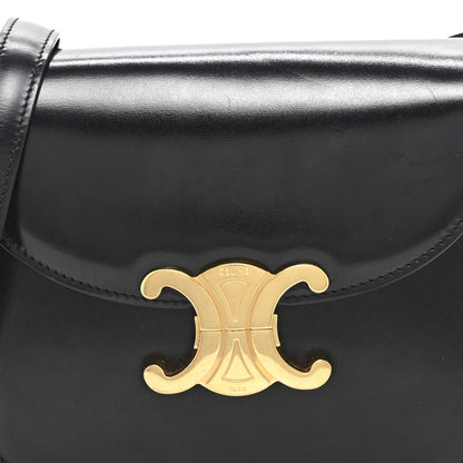Black shiny calfskin flap crossbody bag with gold Triomphe emblem centerpiece
