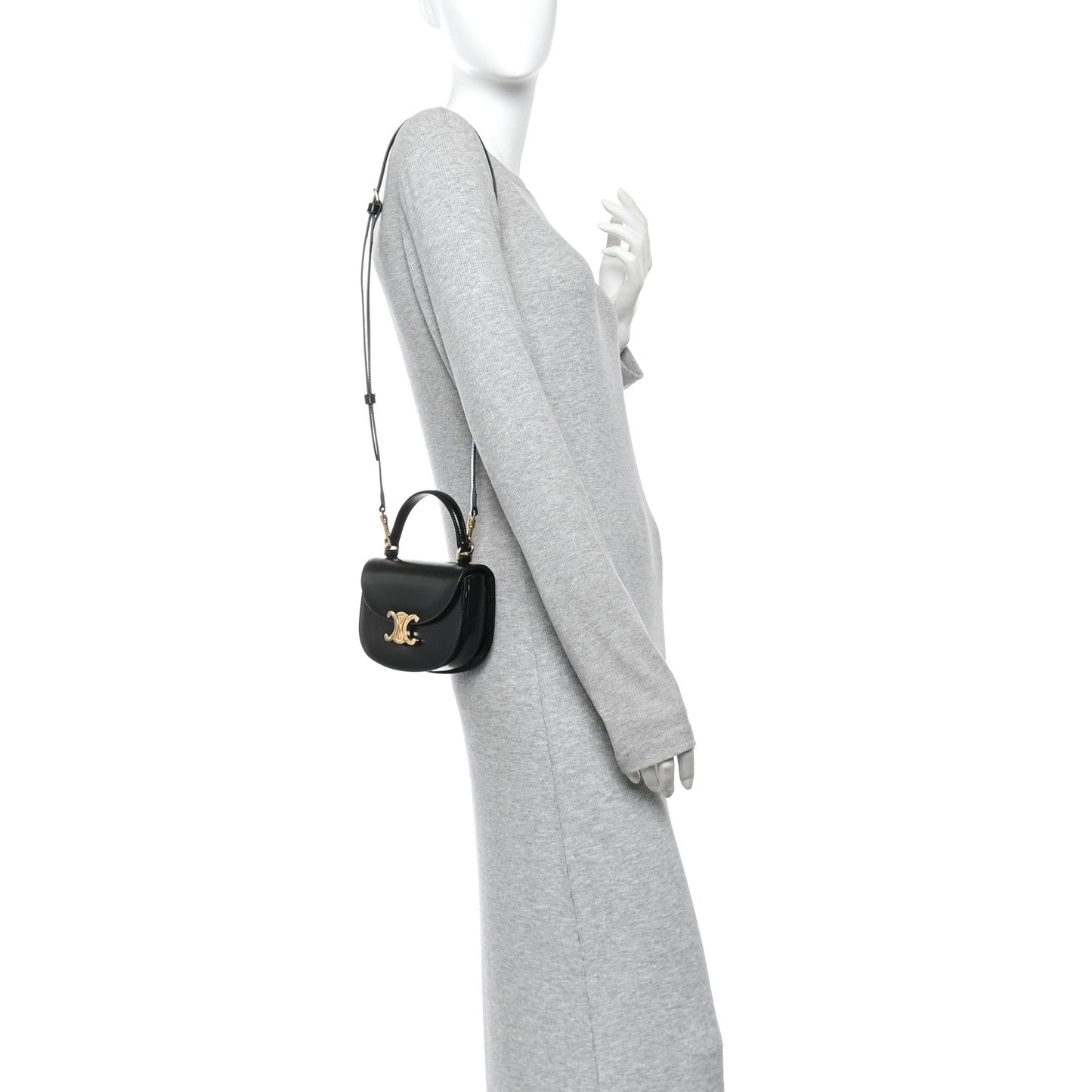 Black mini crossbody bag with short strap and gold-tone logo on front
