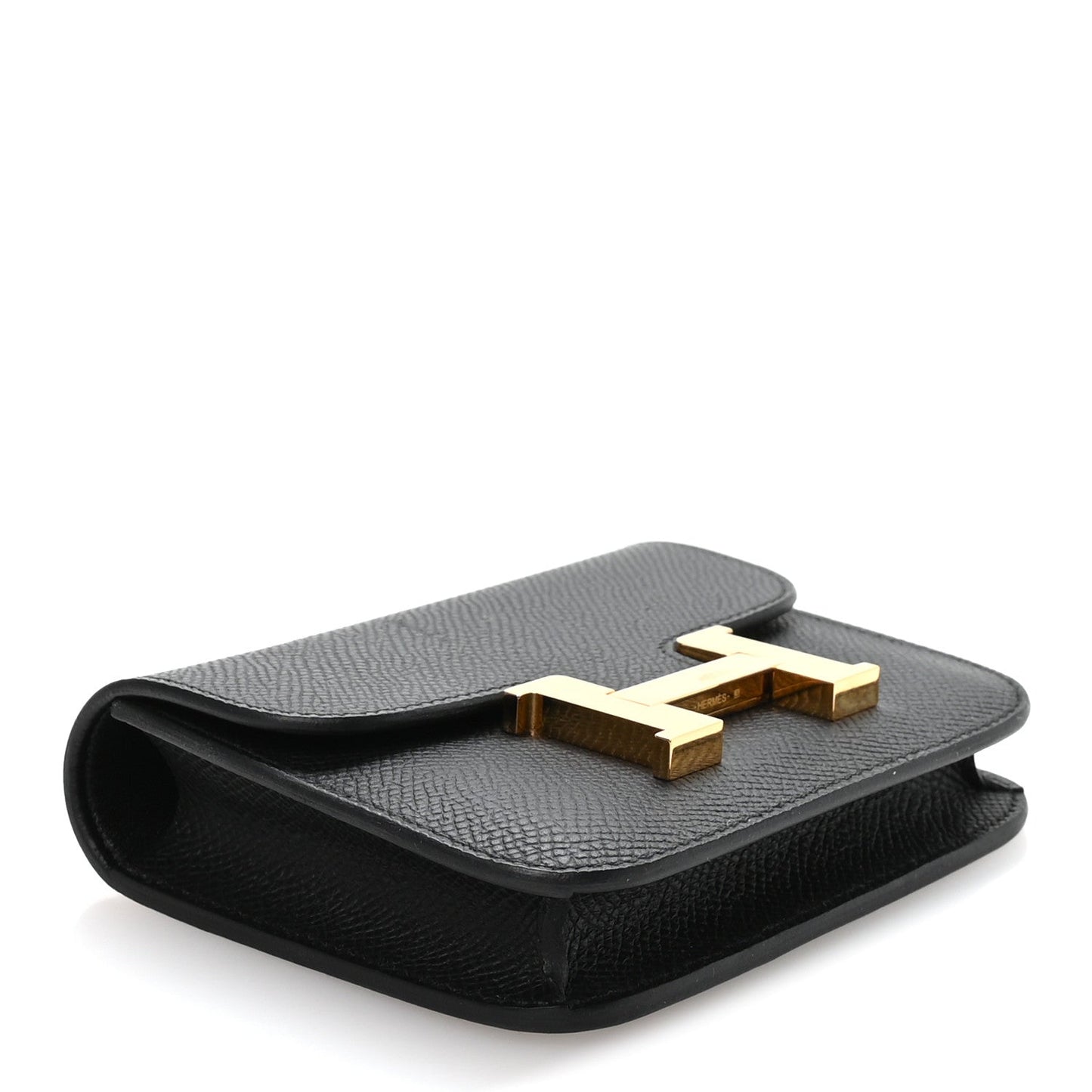 Hermes Constance slim wallet in black with gold H clasp, angled top flap view