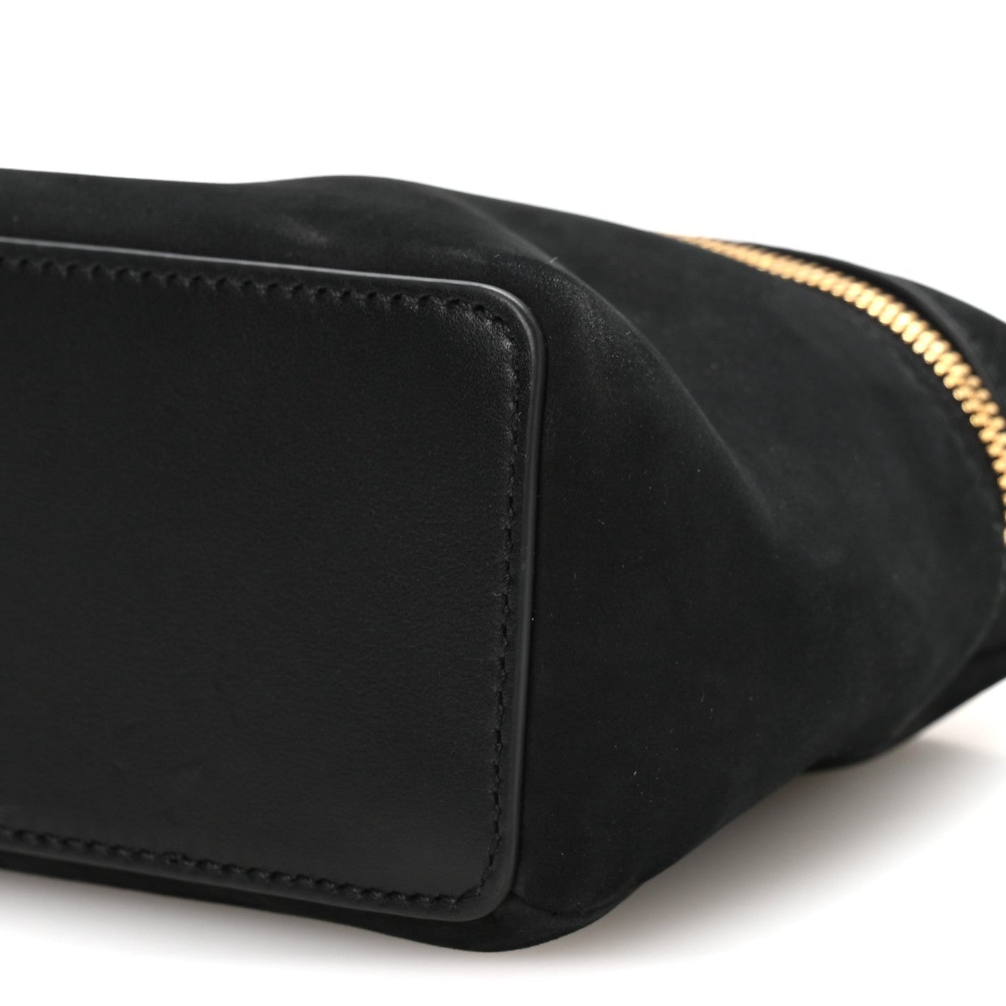 Black nubuck pouch side seam with gold-tone zipper edge