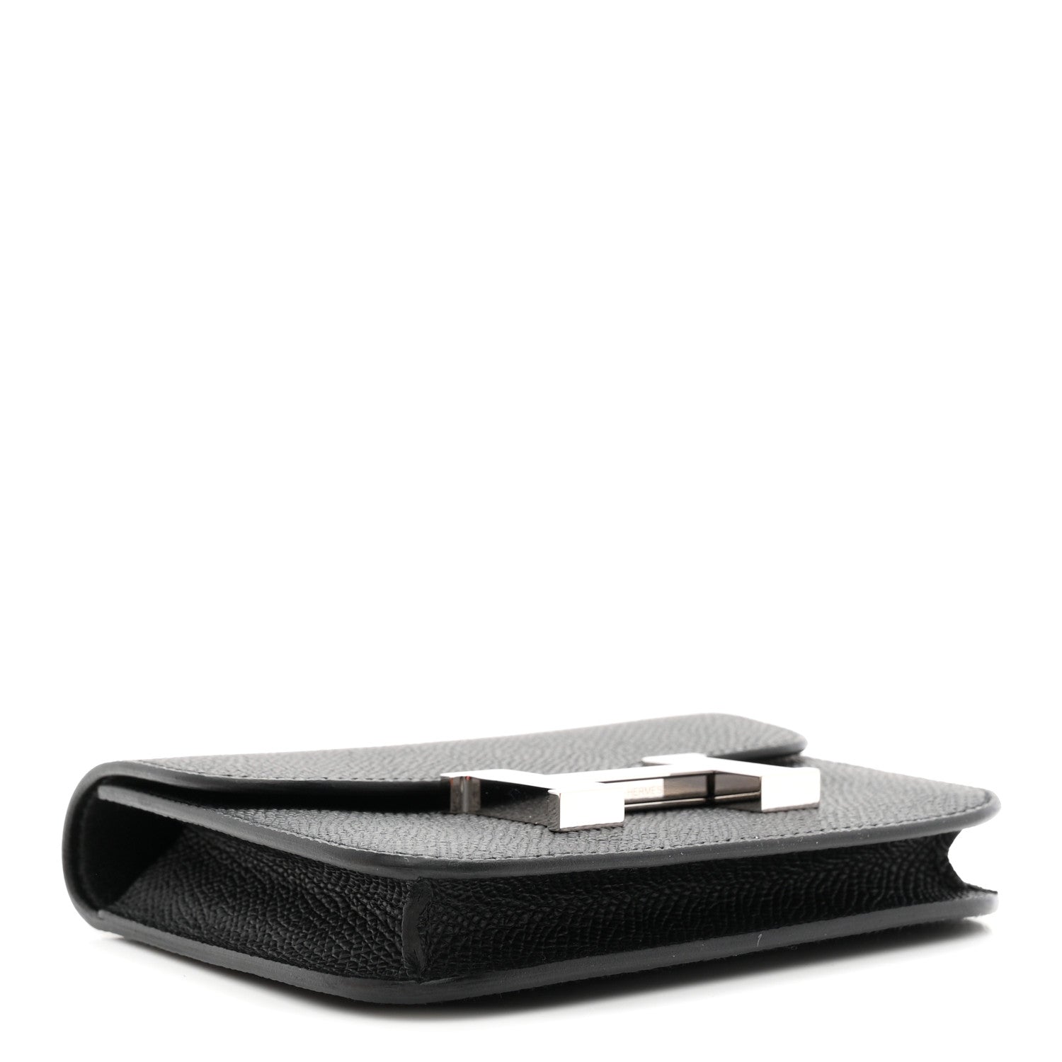 Black slim wallet side view with clasp bar and top edge seam.
